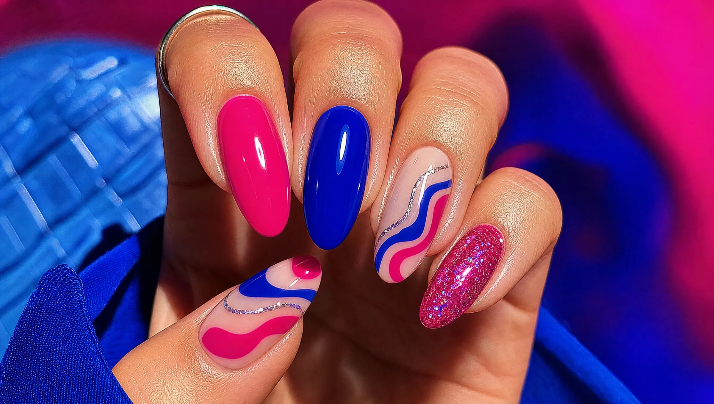 Close-up of a bold, colorful nail set at Gilded Petal Nail Studio